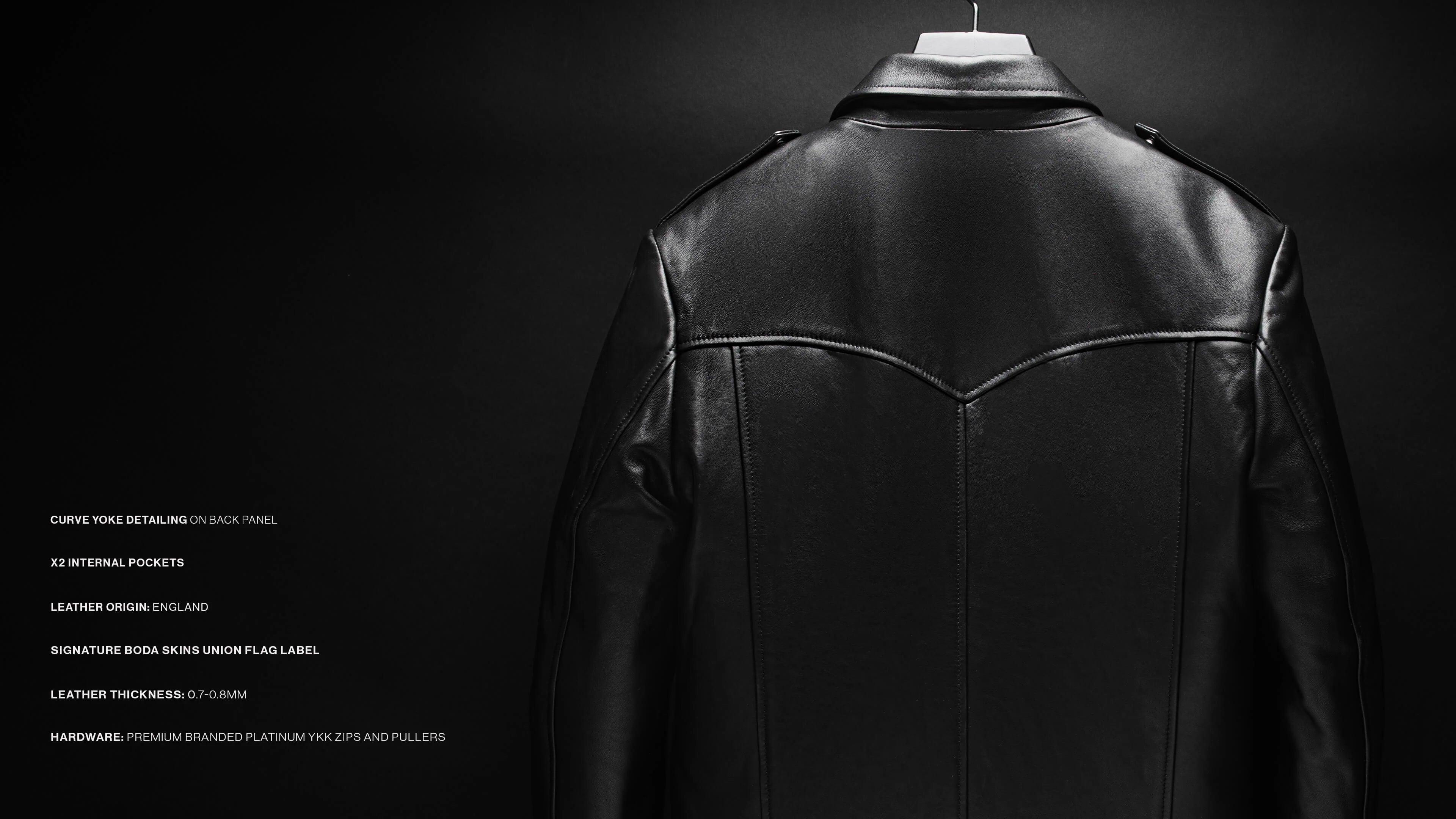 Black leather jacket shown from the back on a hanger against a dark studio background, with small white text listing features on the left side.