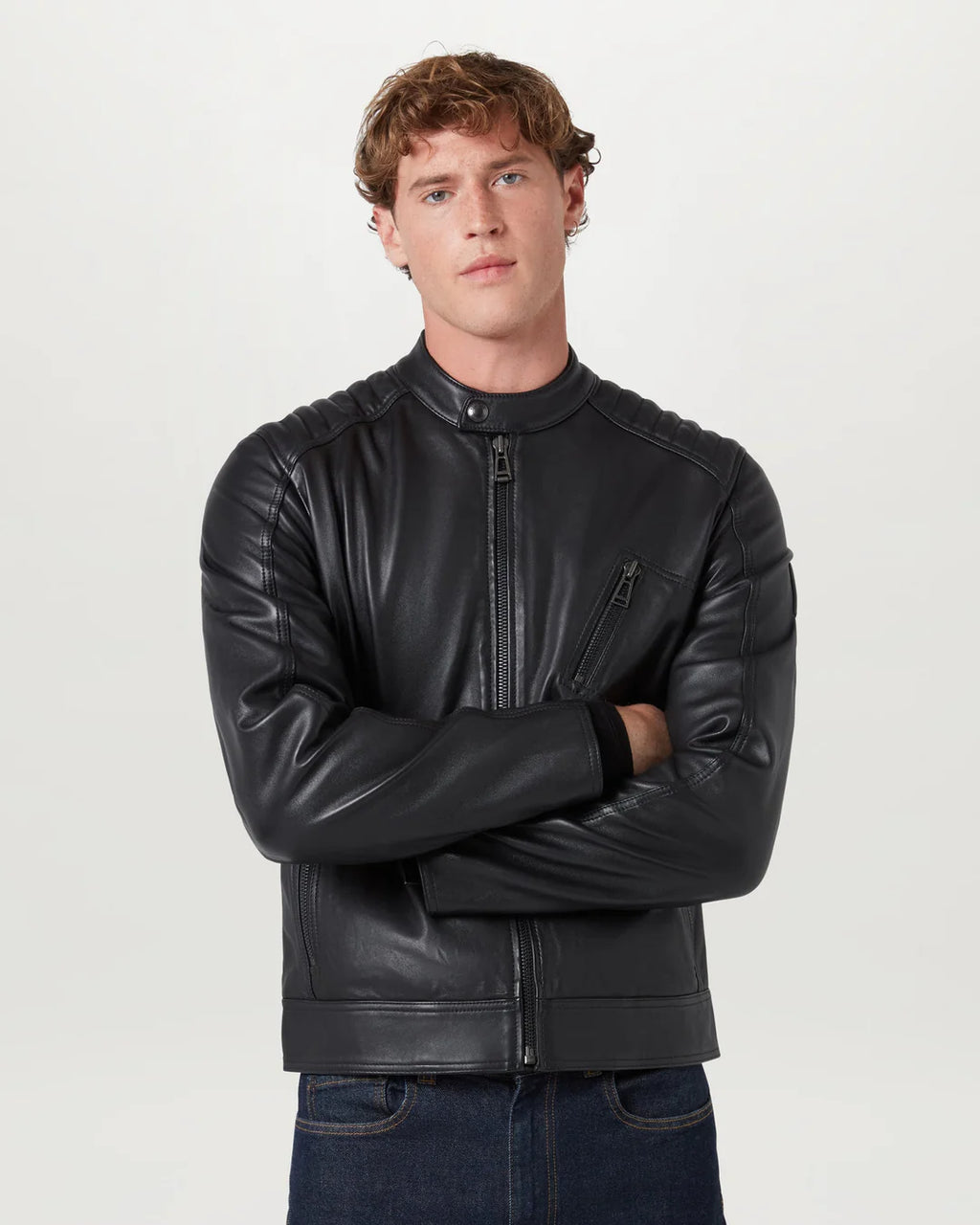 Man wearing a black leather jacket on a white background