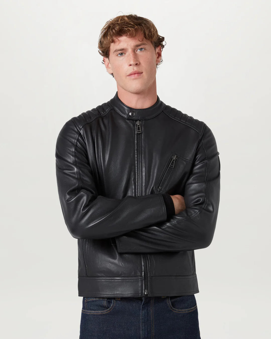 Man wearing a black leather jacket on a white background