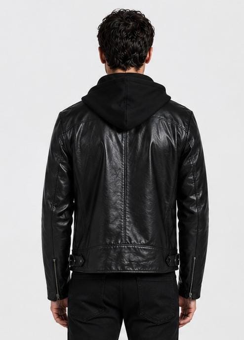 A man viewed from the back wearing a black leather hooded jacket, black pants, and black shoes against a light gray studio background.