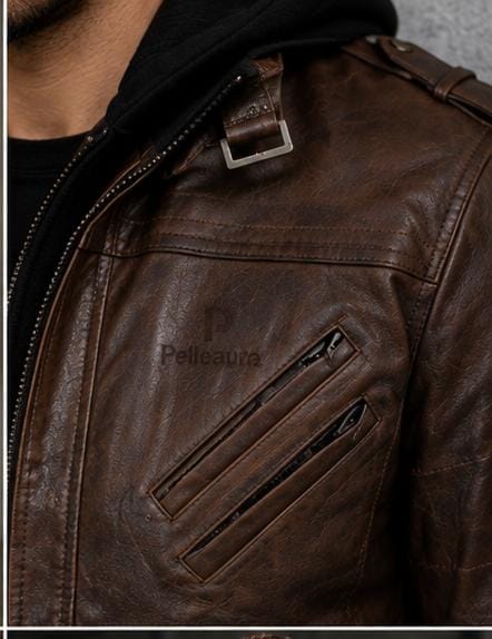 Close-up of a brown leather jacket with a visible 'Pellegrine' logo on the chest, worn over a black hoodie.