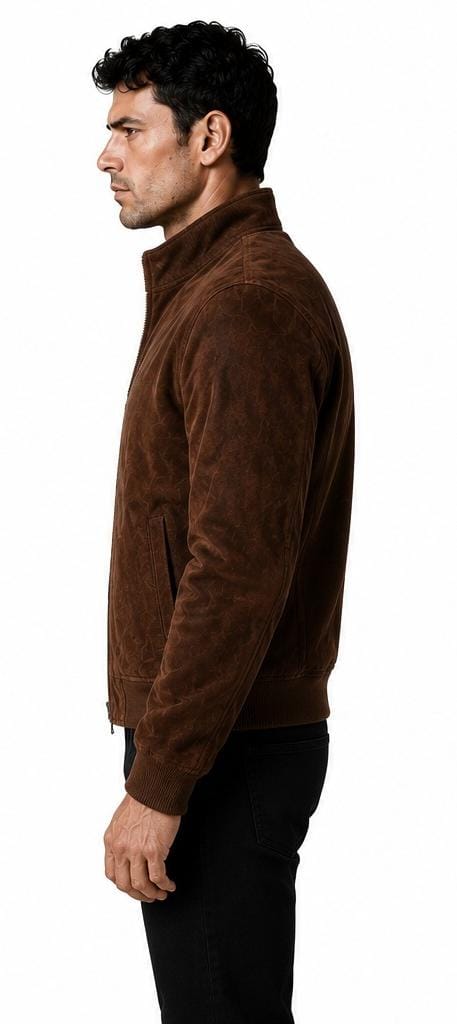 A man shown in profile wearing a brown suede jacket and black pants against a plain white background.
